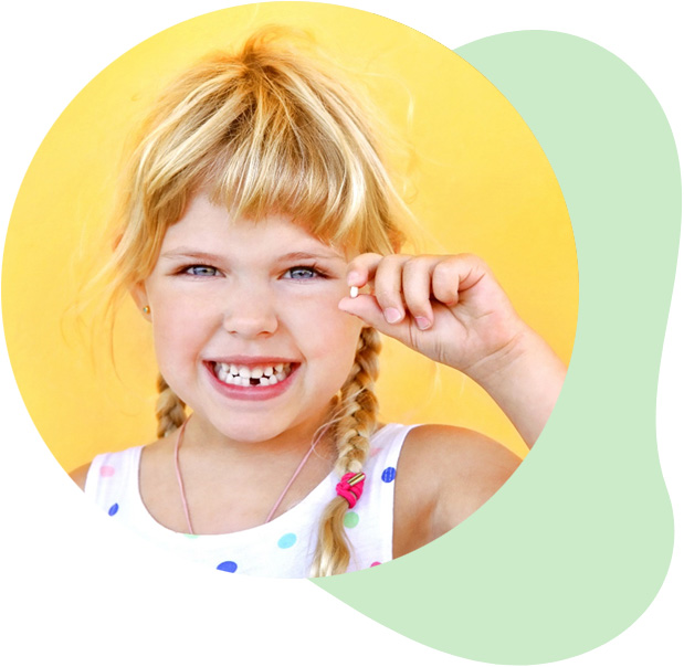 Little blonde girl holding lost tooth